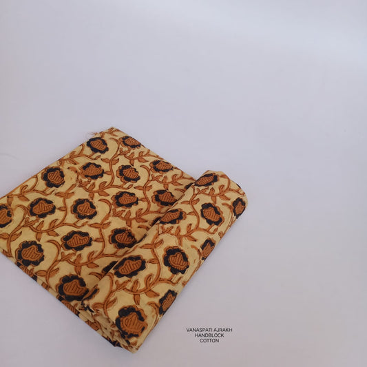 Cream Vanaspati Bagru handblock printed pure cotton fabric, artisan-made with natural dyes for Fabtex wholesale fabric buyers.