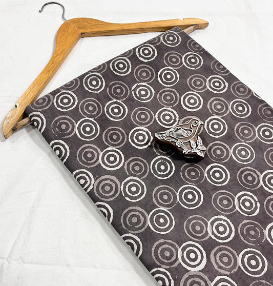 Grey geometrical Dabu handblock printed pure cotton fabric for wholesale buyers, artisan-made mud resist textile by Fabtex