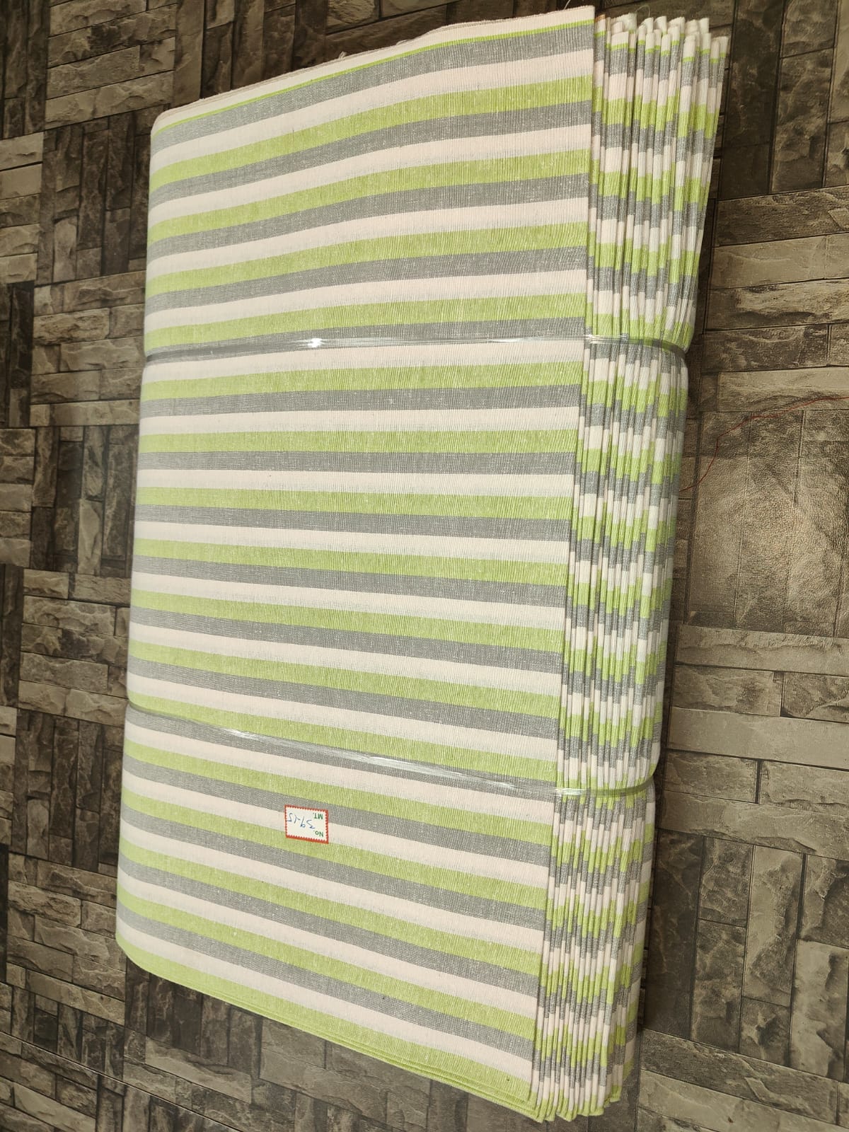 Grey, lime green, and white striped khadi fabric in pure cotton, machine-woven for bulk textile purchasing