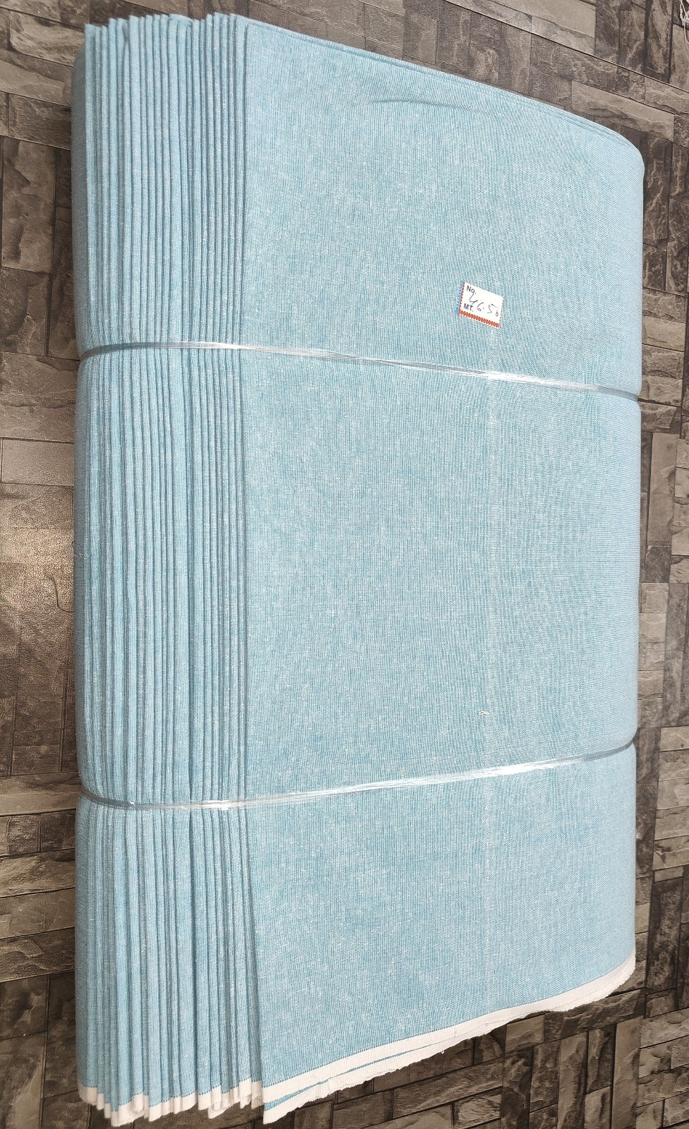 Powder blue and yellow plain khadi cotton fabric, machine-woven for wholesale buyers