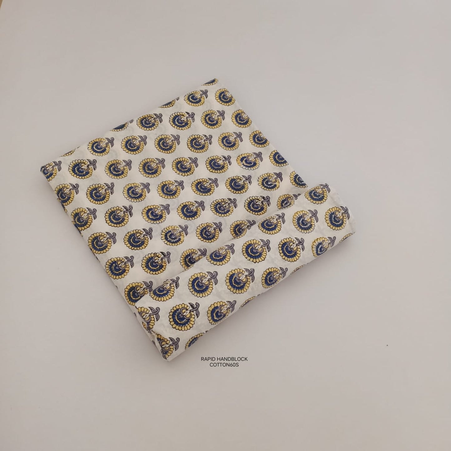 Jaipur Sanganeri Handblock Cotton Fabric in cream with floral butti print, artisan-crafted and perfect for B2B bulk sourcing.