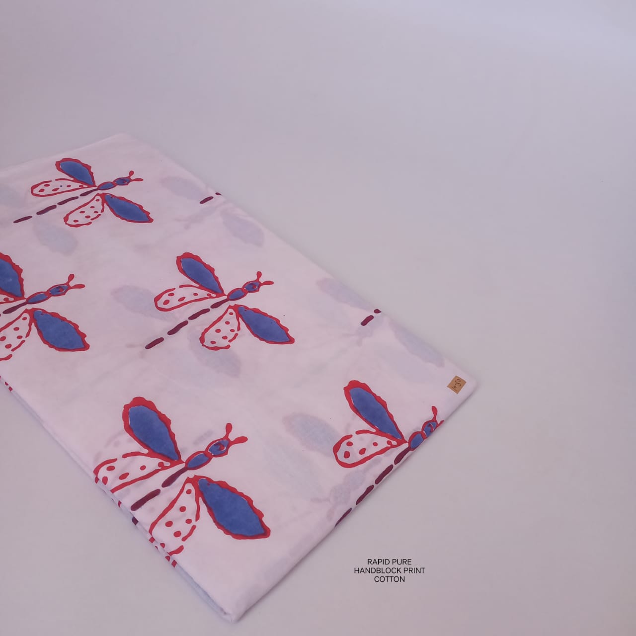 Wholesale Jaipur Sanganeri Handblock Cotton Fabric in white with butterfly motif print, slow-made by skilled artisans, perfect for B2B bulk orders.