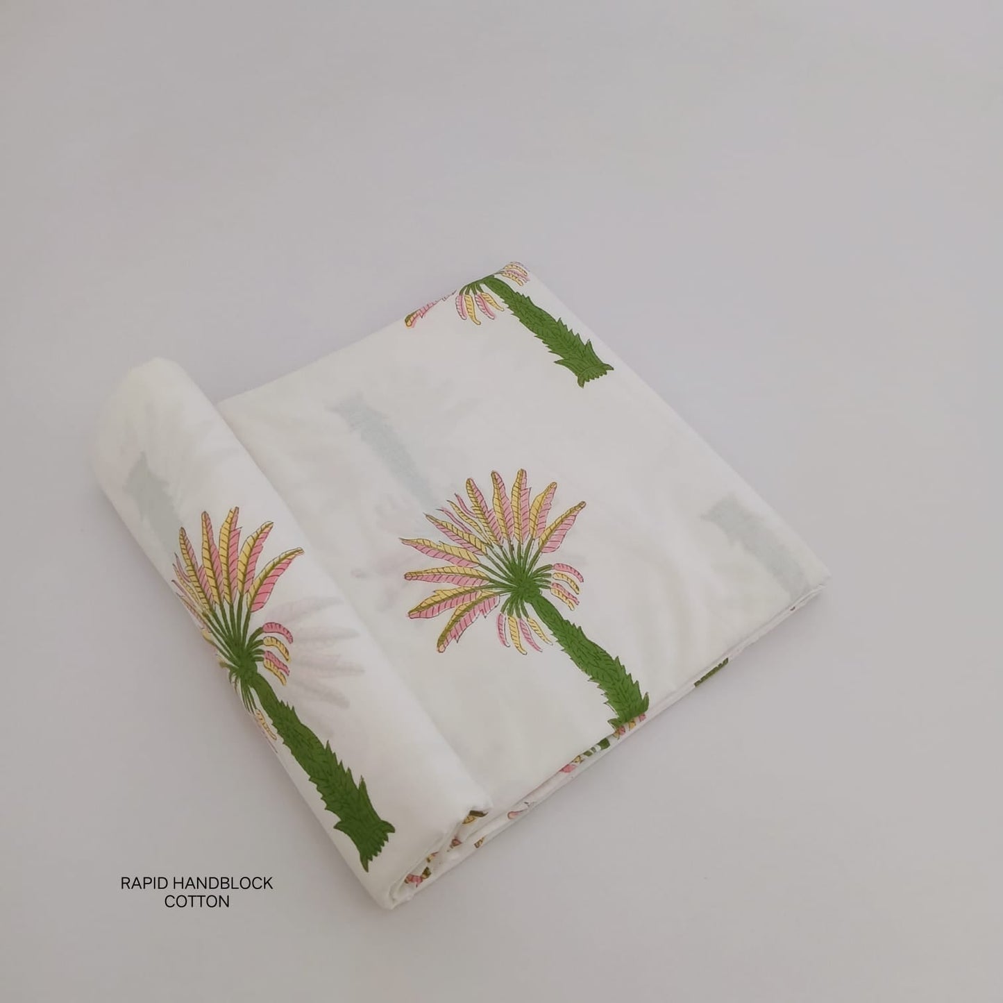 Wholesale Jaipur Sanganeri Handblock Cotton Fabric in white with coconut tree print, artisan-crafted for boutiques, designers, and retailers.