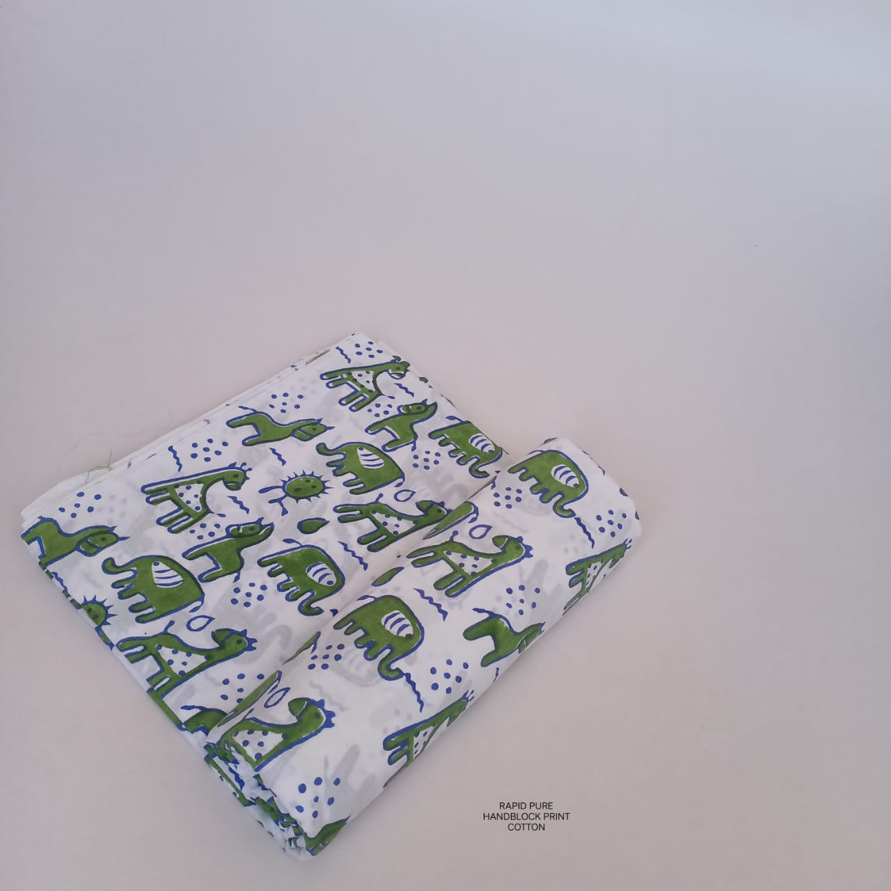 Wholesale Jaipur Sanganeri Handblock Cotton Fabric in white featuring elephant print, slow-made and natural-dyed, perfect for bulk orders.