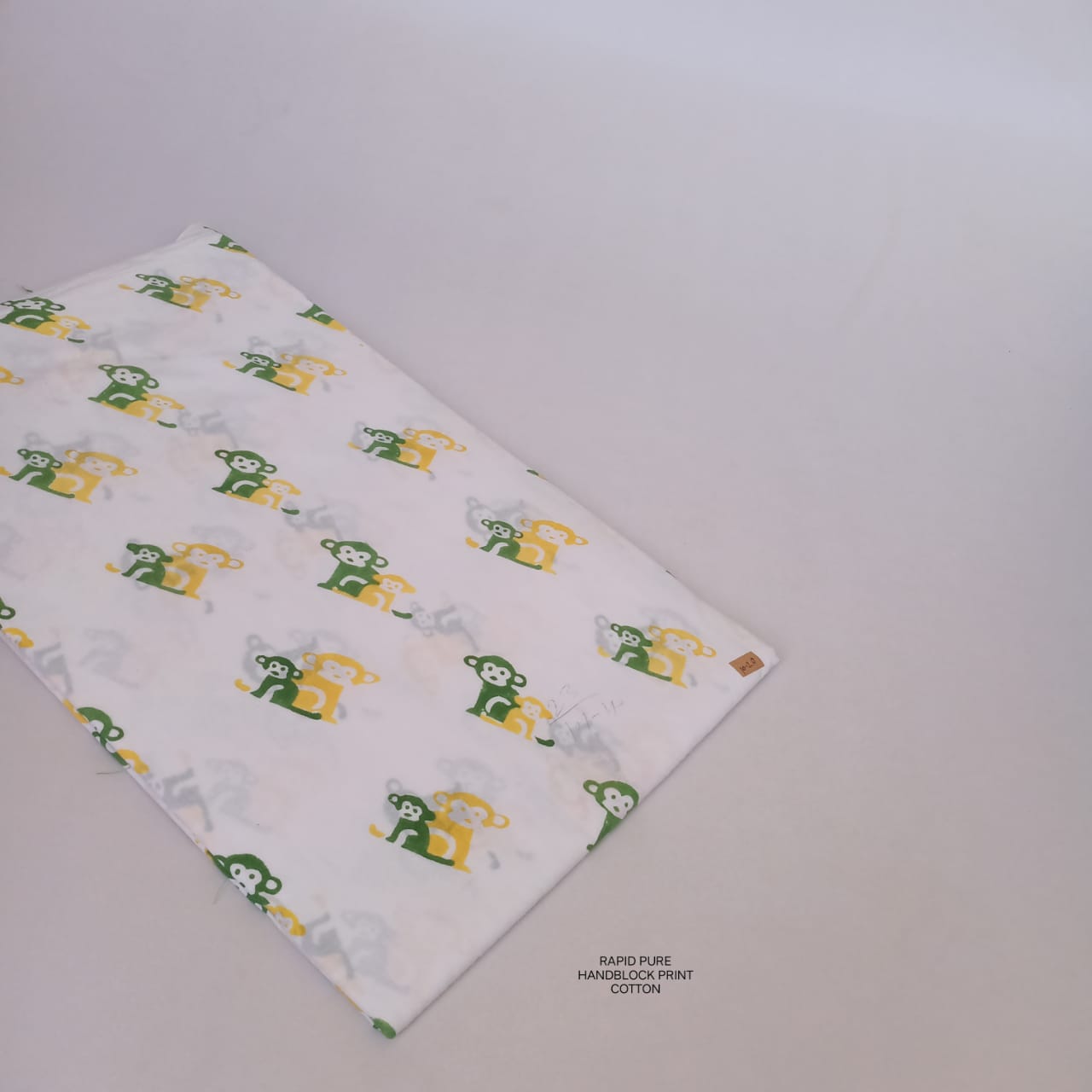 Jaipur Sanganeri Handblock Cotton Fabric in white with monkey motif print, handcrafted for B2B buyers, designers, and retailers.