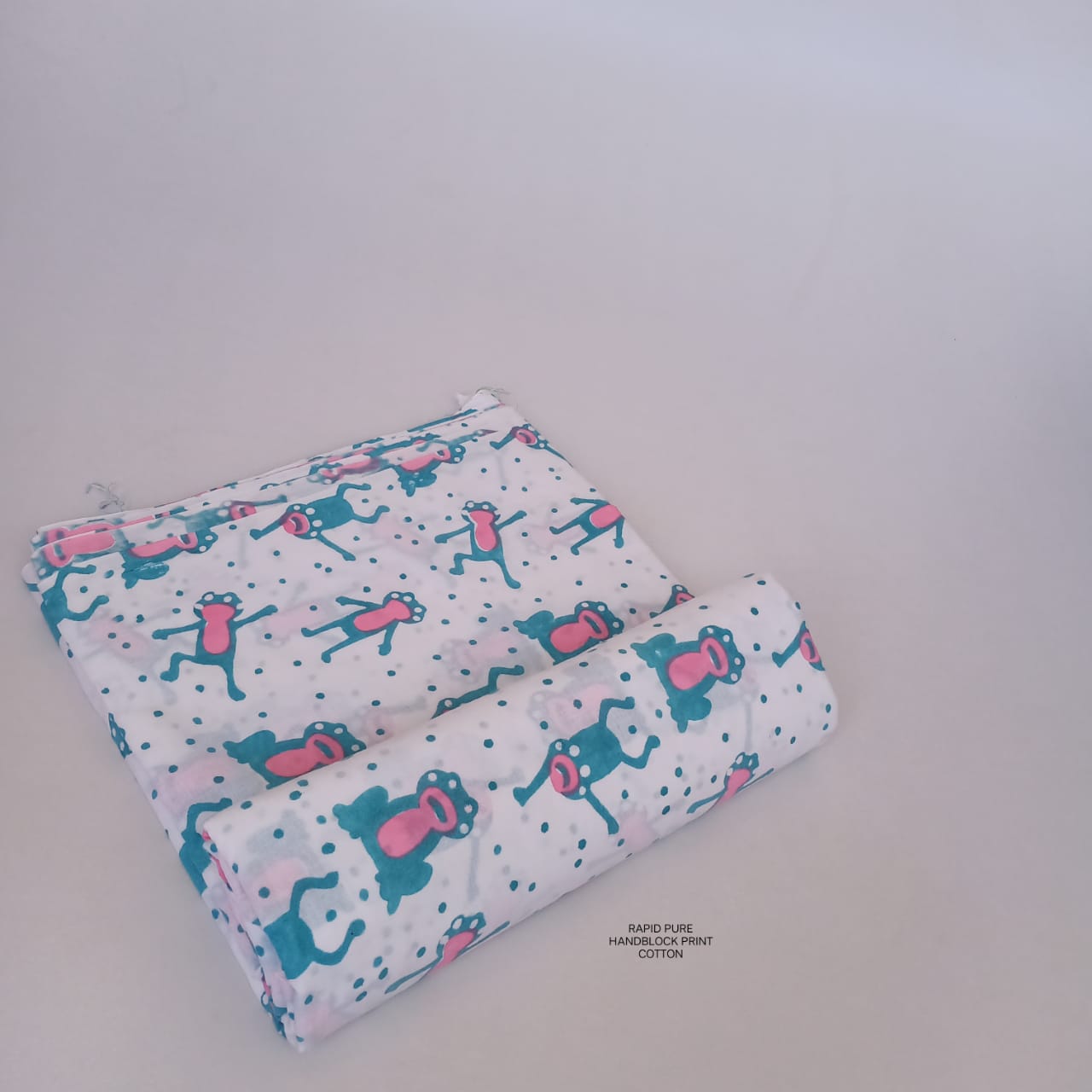 Wholesale Jaipur Sanganeri Handblock Cotton Fabric in white with monkey motif print, ideal for designers, boutiques, and retailers.