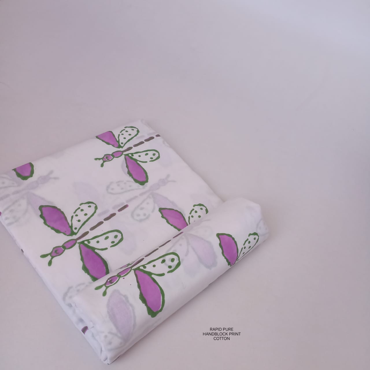 Jaipur Sanganeri Handblock Cotton Fabric in white and pink with butterfly buta print, artisan-made for wholesale and B2B sourcing.