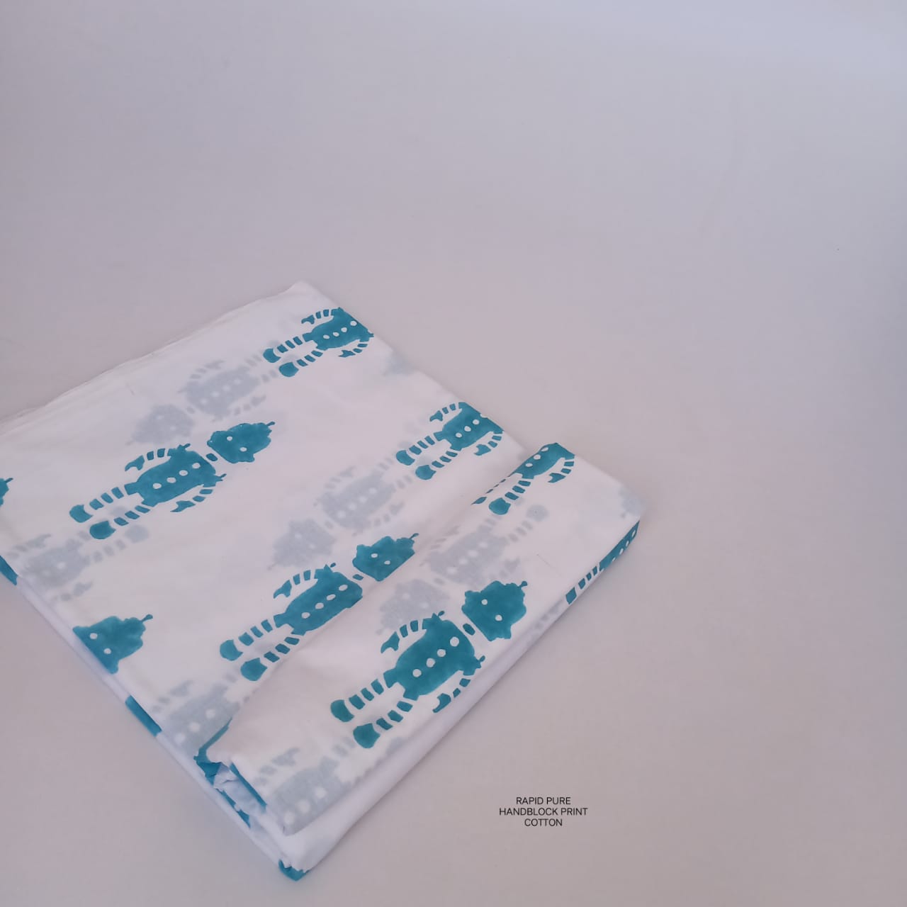 Wholesale Jaipur Sanganeri Handblock Cotton Fabric in white with robot print, slow-made by skilled artisans, perfect for designers and retailers.