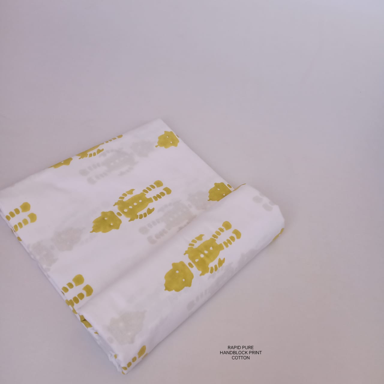 Artisan-crafted Jaipur Sanganeri Handblock Cotton Fabric in white and yellow featuring robot motif, ideal for B2B bulk orders.