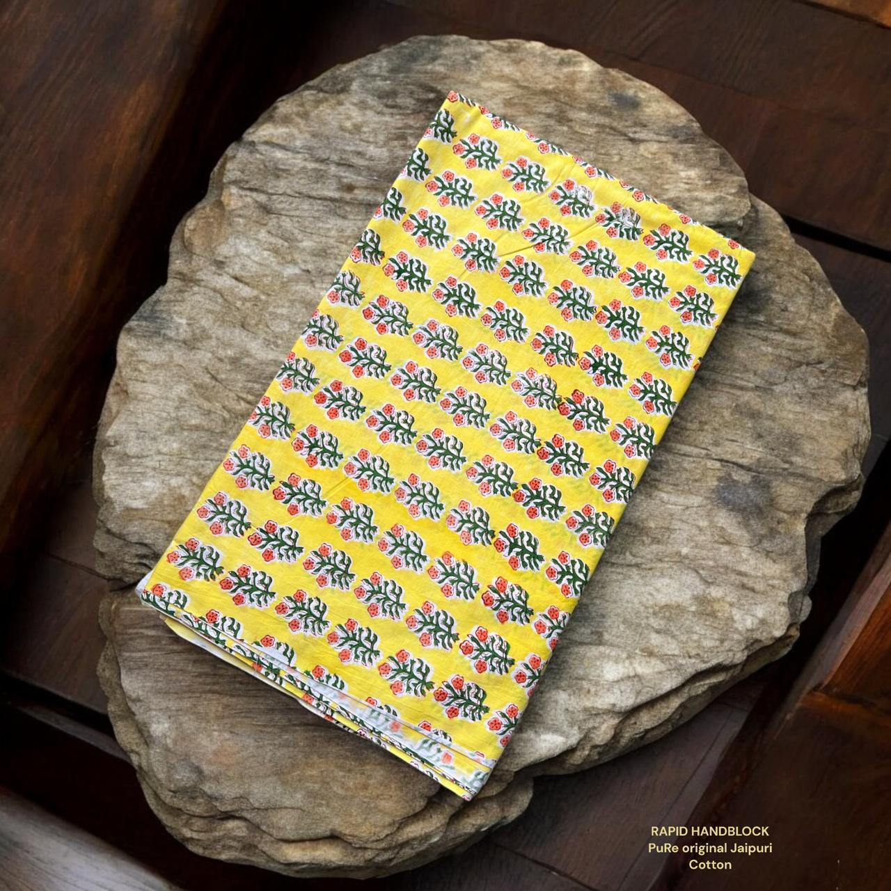 Wholesale Jaipur Sanganeri Handblock Cotton Fabric in yellow featuring floral butti print, slow-made by skilled artisans for retailers and boutiques.