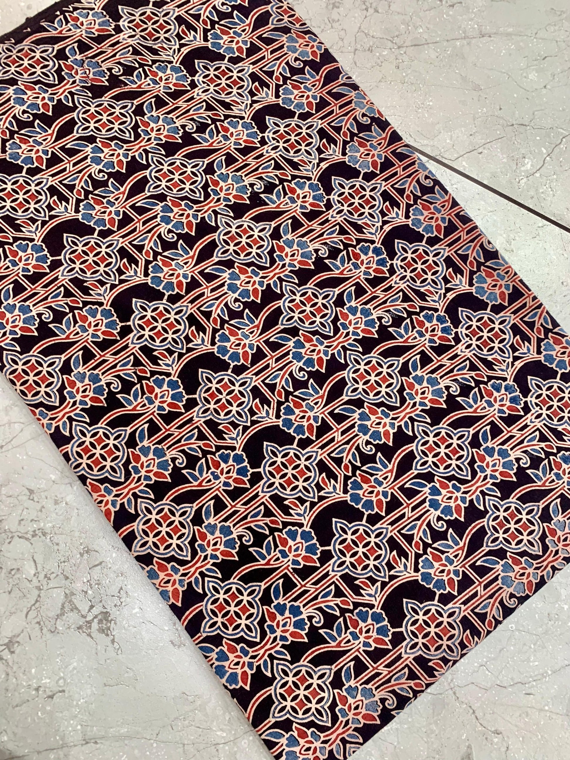 Black Ajrakh floral handblock printed pure cotton fabric wholesale with natural-dye impressions by Fabtexs.