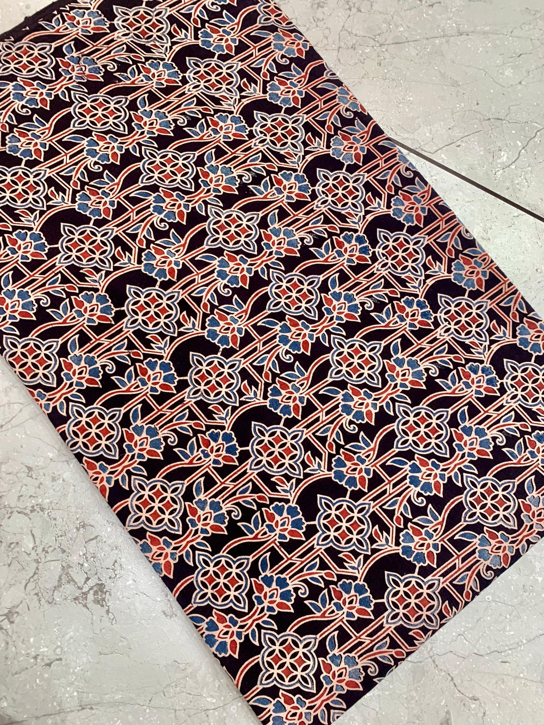 Black Ajrakh floral handblock printed pure cotton fabric wholesale with natural-dye impressions by Fabtexs.