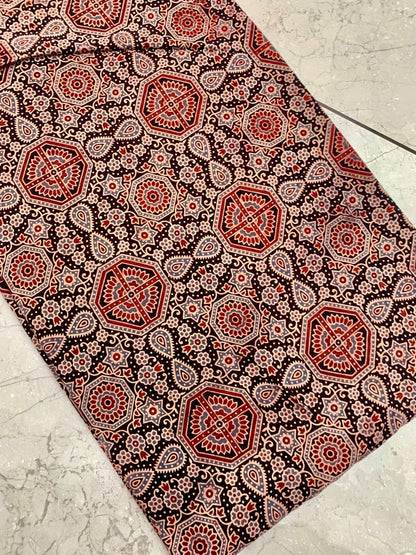 Black-red Ajrakh pure cotton wholesale fabric showcasing classic block-printed patterns for boutique collections.