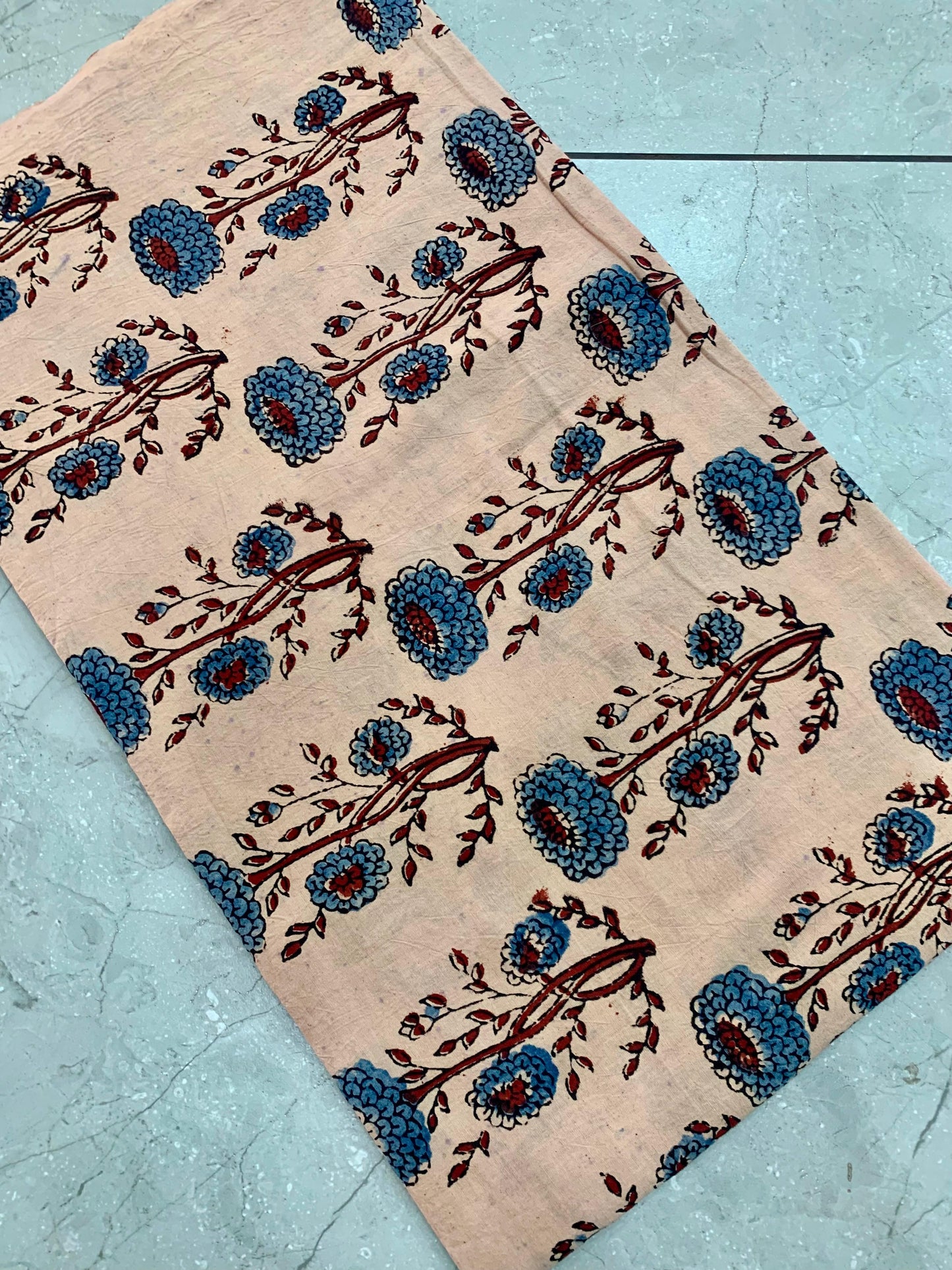 Cream Ajrakh pure cotton handblock printed wholesale fabric featuring delicate floral motifs by Fabtexs.