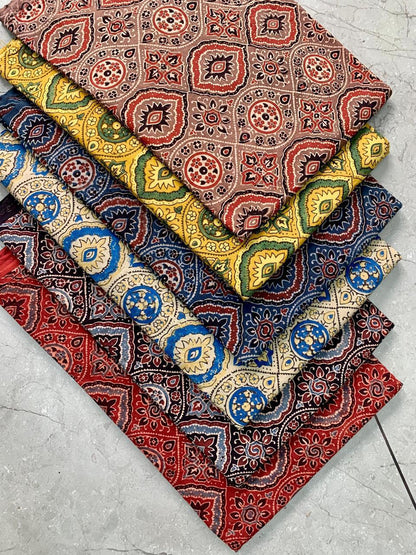 Cream multi-colour Ajrakh handblock printed pure cotton fabric featuring classic Rajasthan motifs for bulk purchase