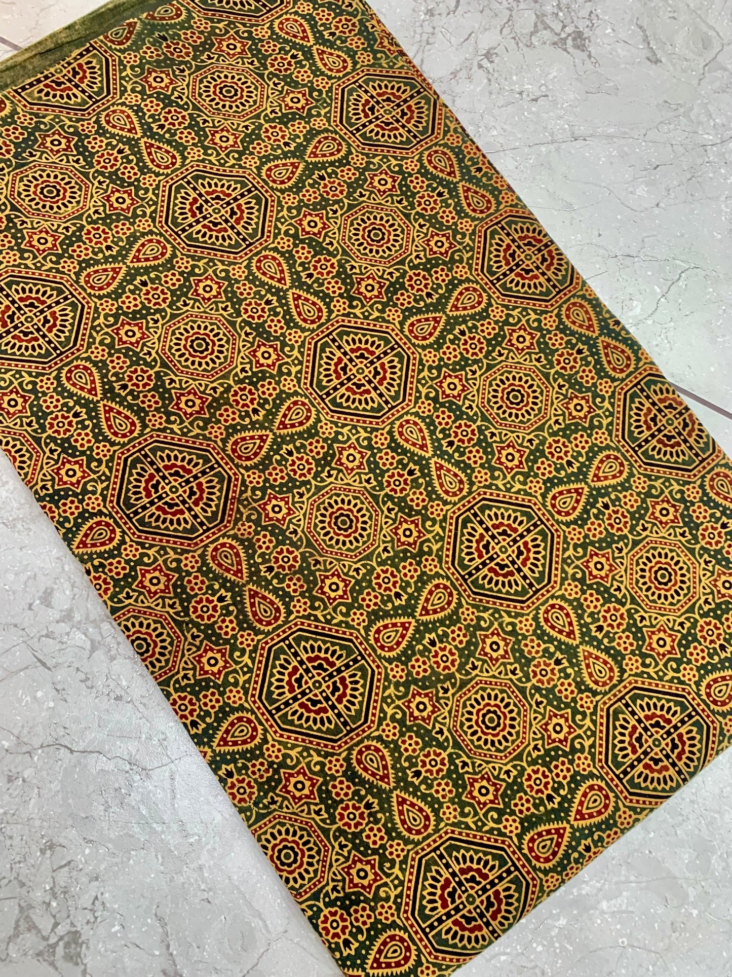 Green Ajrakh pure cotton handblock printed wholesale fabric with earthy geometric design work by Fabtexs.