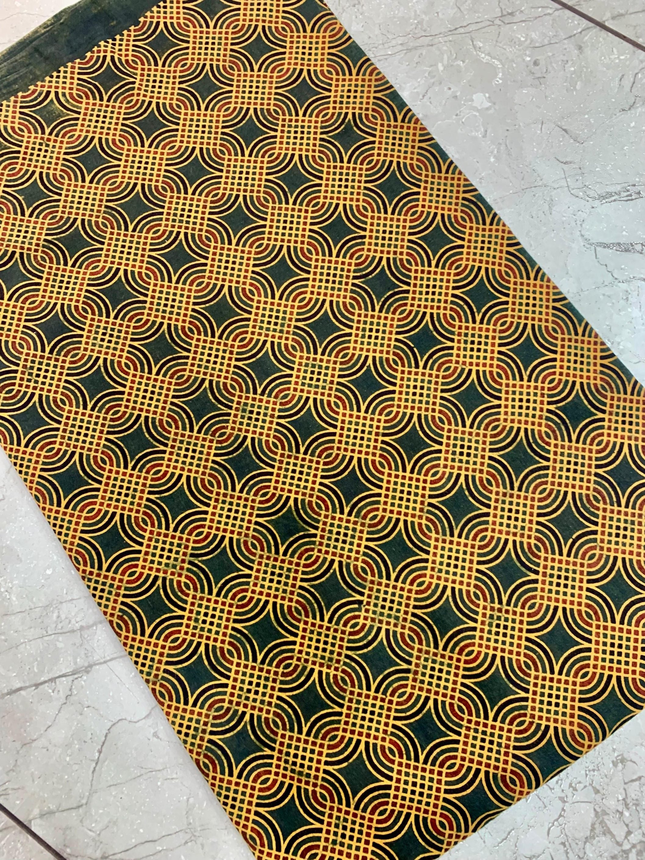 Green geometric Ajrakh print pure cotton fabric wholesale, artisan-made with earthy natural dye patterns.