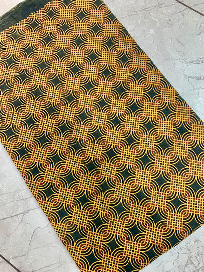 Green geometric Ajrakh print pure cotton fabric wholesale, artisan-made with earthy natural dye patterns.
