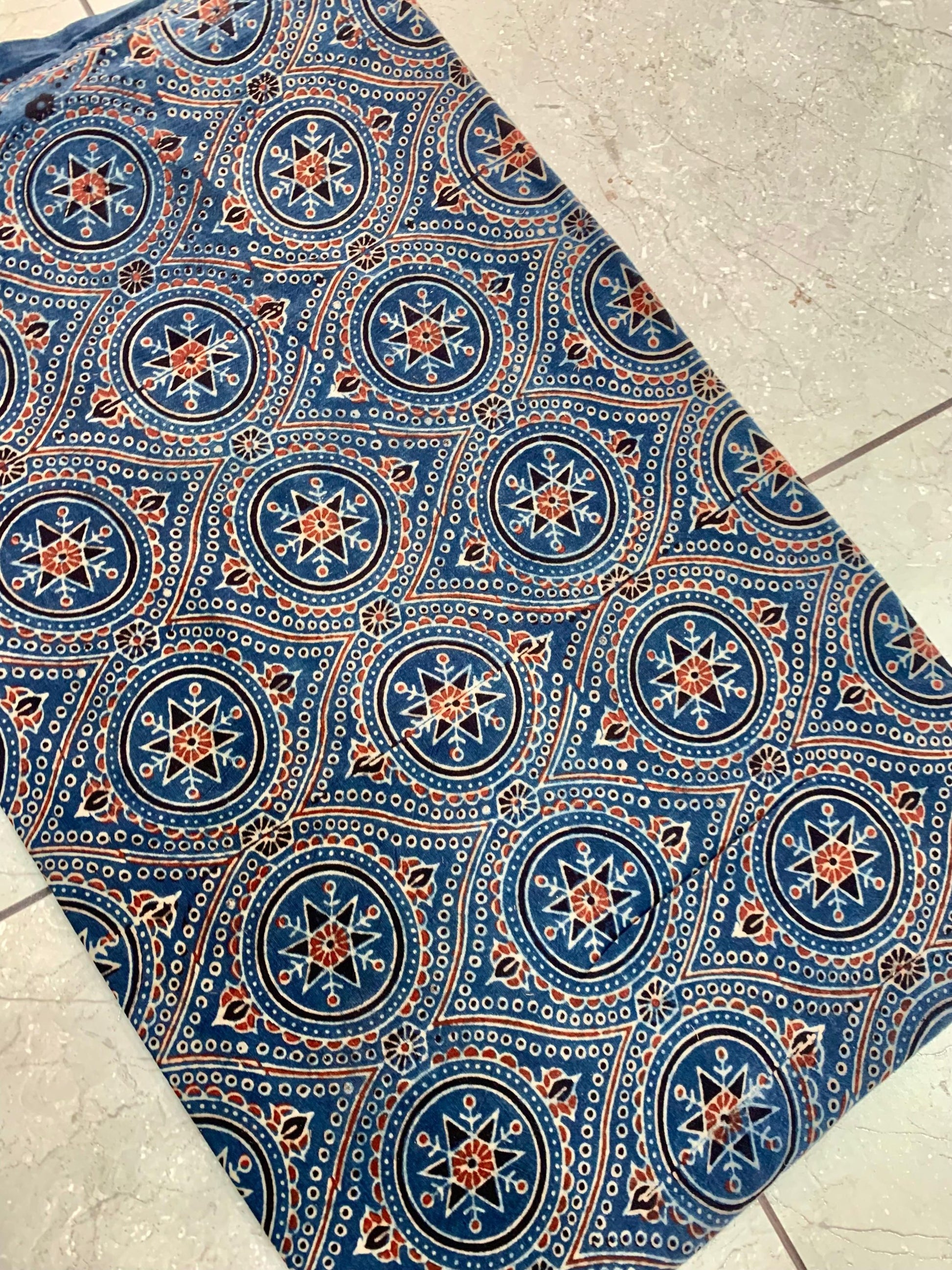 Indigo Ajrakh handblock printed pure cotton fabric wholesale — traditional natural-dyed motifs crafted by Kutch artisans.