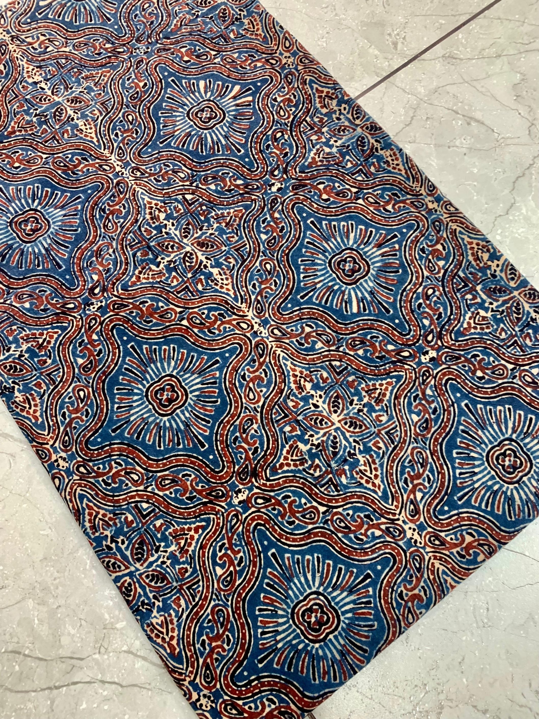 Indigo Jaal Ajrakh handblock printed pure cotton wholesale fabric with rich traditional repeating motifs.