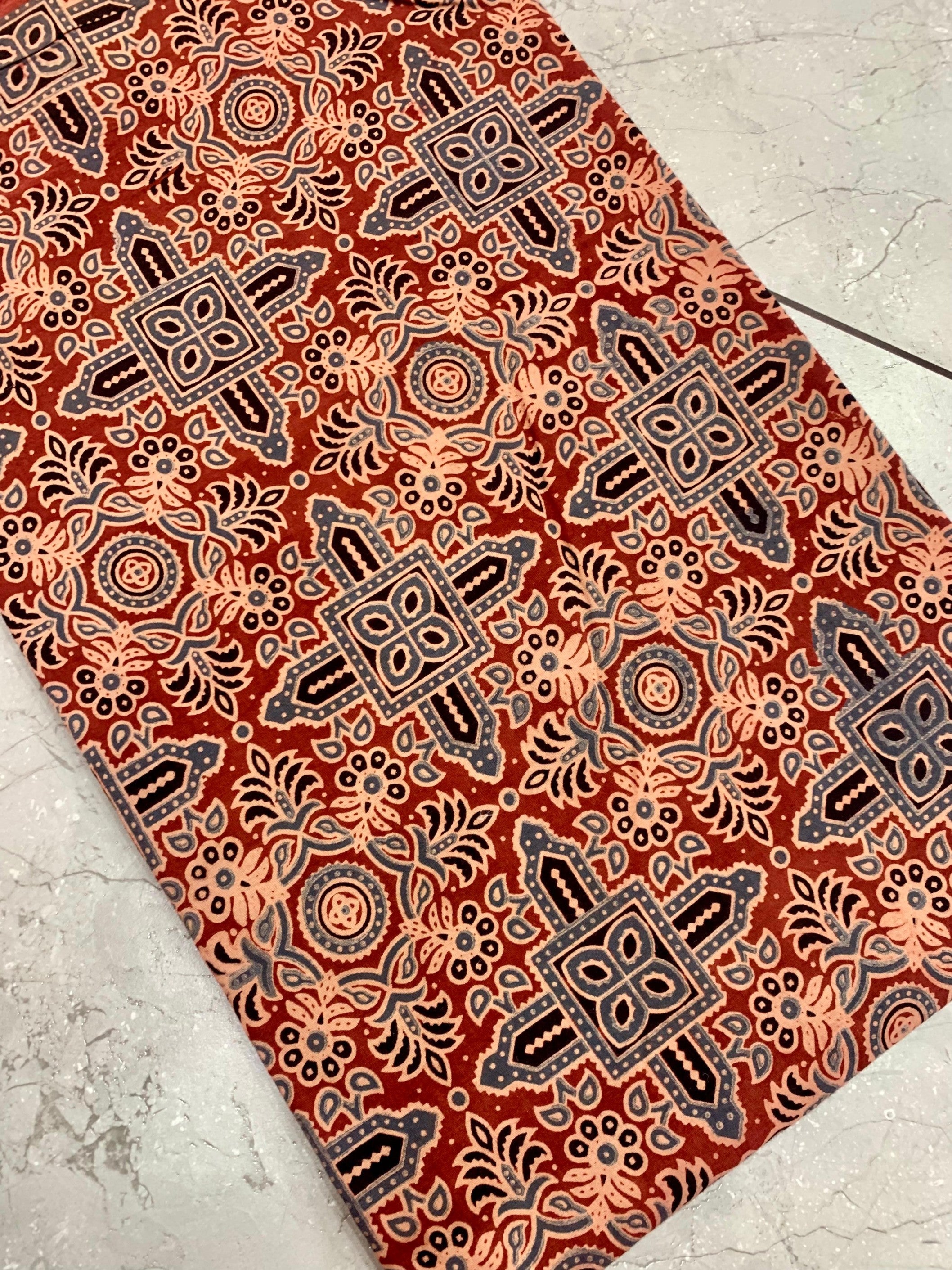 Maroon Ajrakh pure cotton handblock printed wholesale fabric with signature artisan design work by Fabtexs.