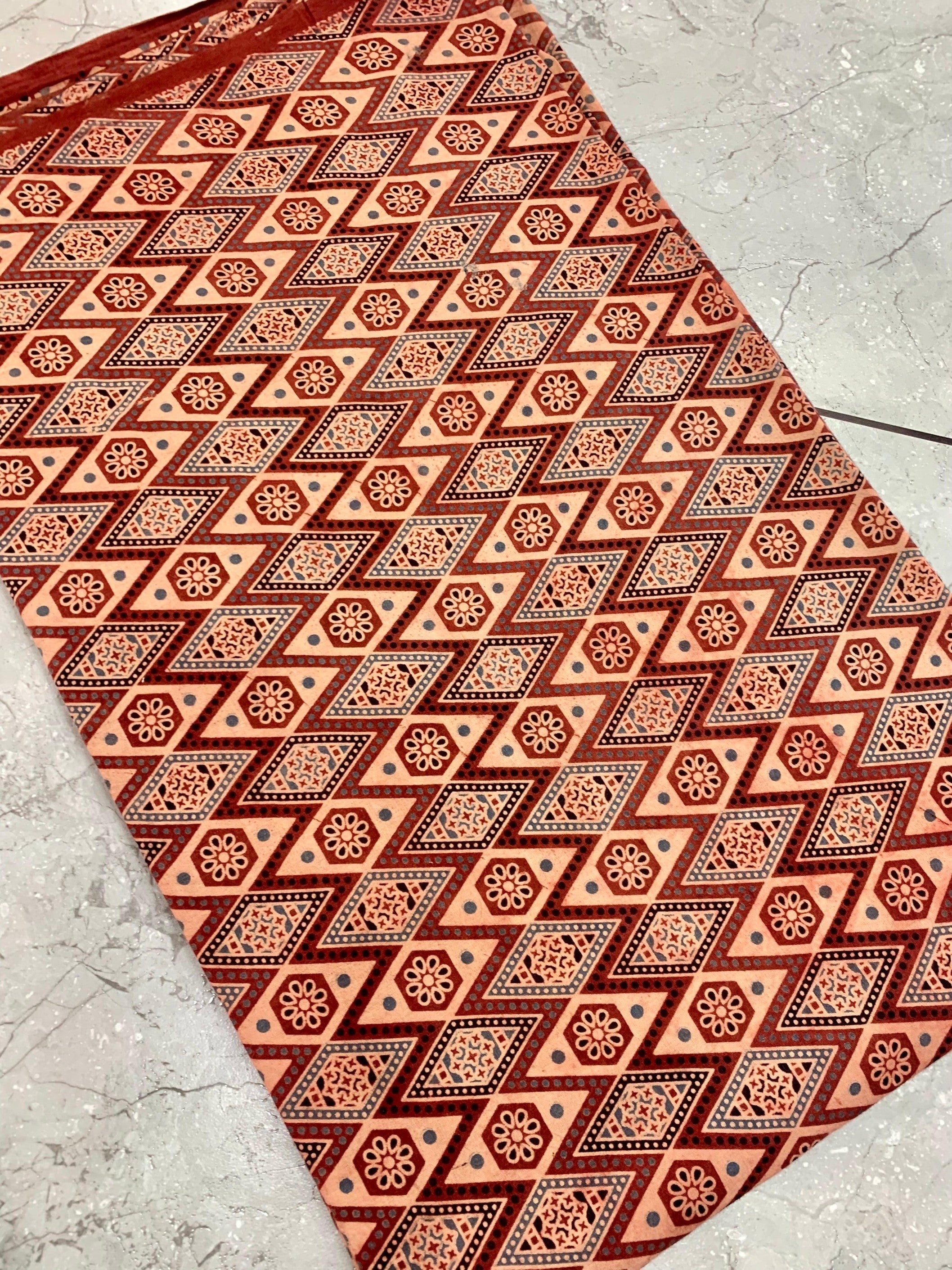 Maroon Ajrakh handblock printed pure cotton wholesale fabric with bold geometrical motifs by Fabtexs.