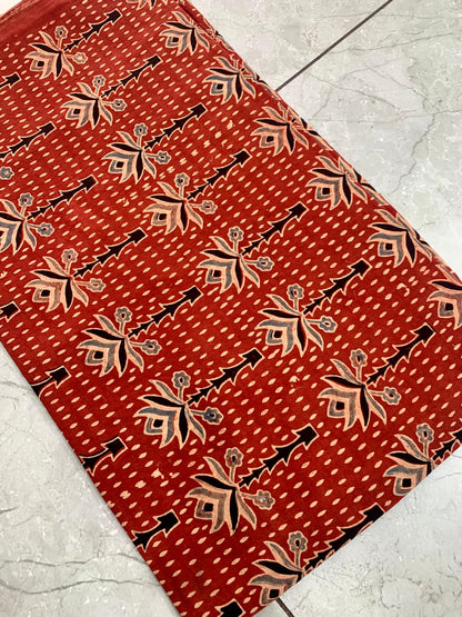 Maroon tree-motif Ajrakh handblock printed cotton wholesale fabric inspired by traditional Kutch symbols.