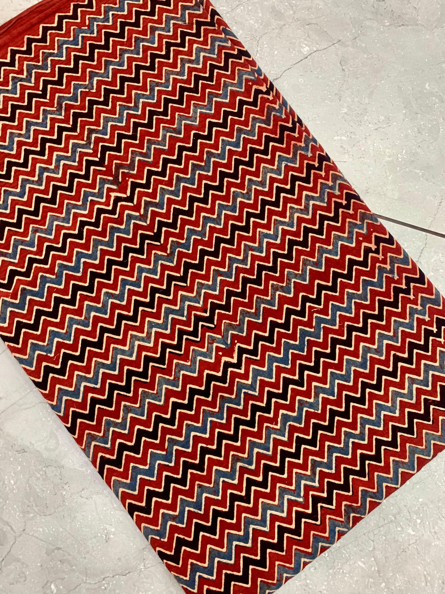 Maroon zig-zag Ajrakh handblock printed pure cotton wholesale fabric with handcrafted detailing by Fabtexs.