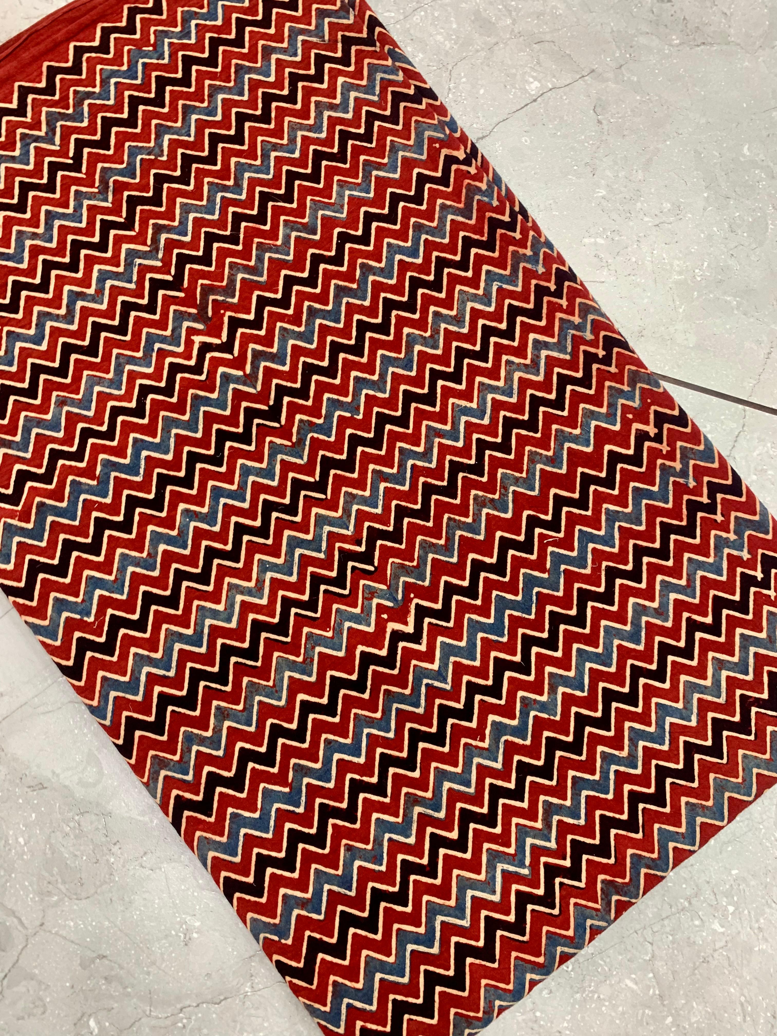 Maroon zig-zag Ajrakh handblock printed pure cotton wholesale fabric with handcrafted detailing by Fabtexs.