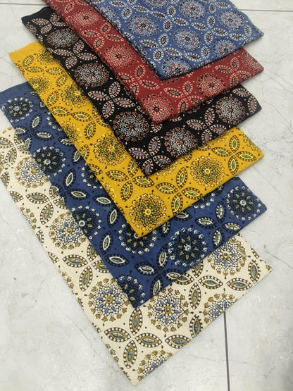 Black multi-color Ajrakh handblock printed pure cotton wholesale fabric with traditional motifs by Fabtexs.