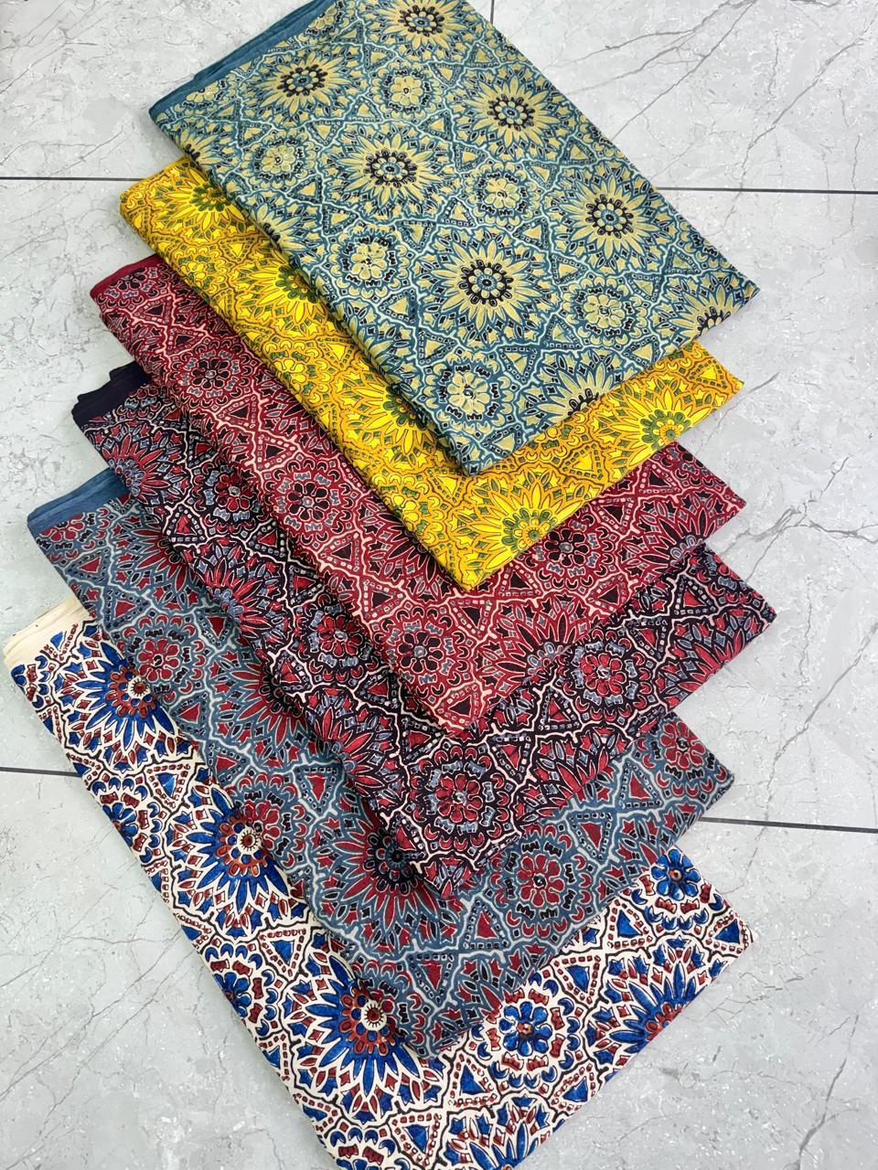 Cream-based multi-color Ajrakh pure cotton handblock printed wholesale fabric, artisan-made by Fabtexs.