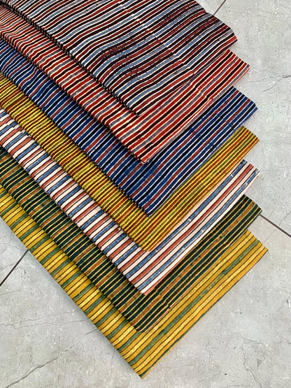 Ajrakh pure cotton handblock printed fabric combining jaal and stripe patterns in traditional colours
