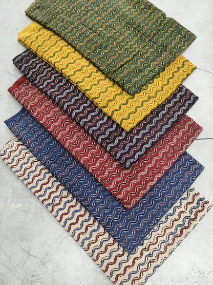 Wave-pattern multi-color Ajrakh handblock printed cotton fabric wholesale, handcrafted by Fabtexs.