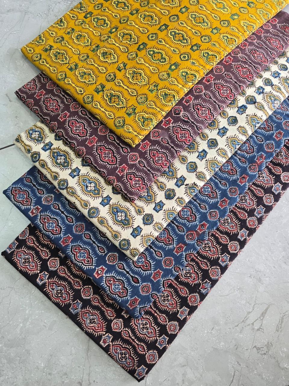 Mustard colour Ajrakh pure cotton handblock printed wholesale fabric featuring traditional motifs – handcrafted for Fabtexs