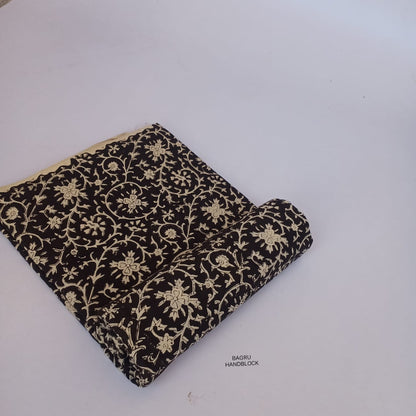 Black floral Bagru handblock printed cotton fabric, handcrafted with precision using natural dyes and traditional motifs.