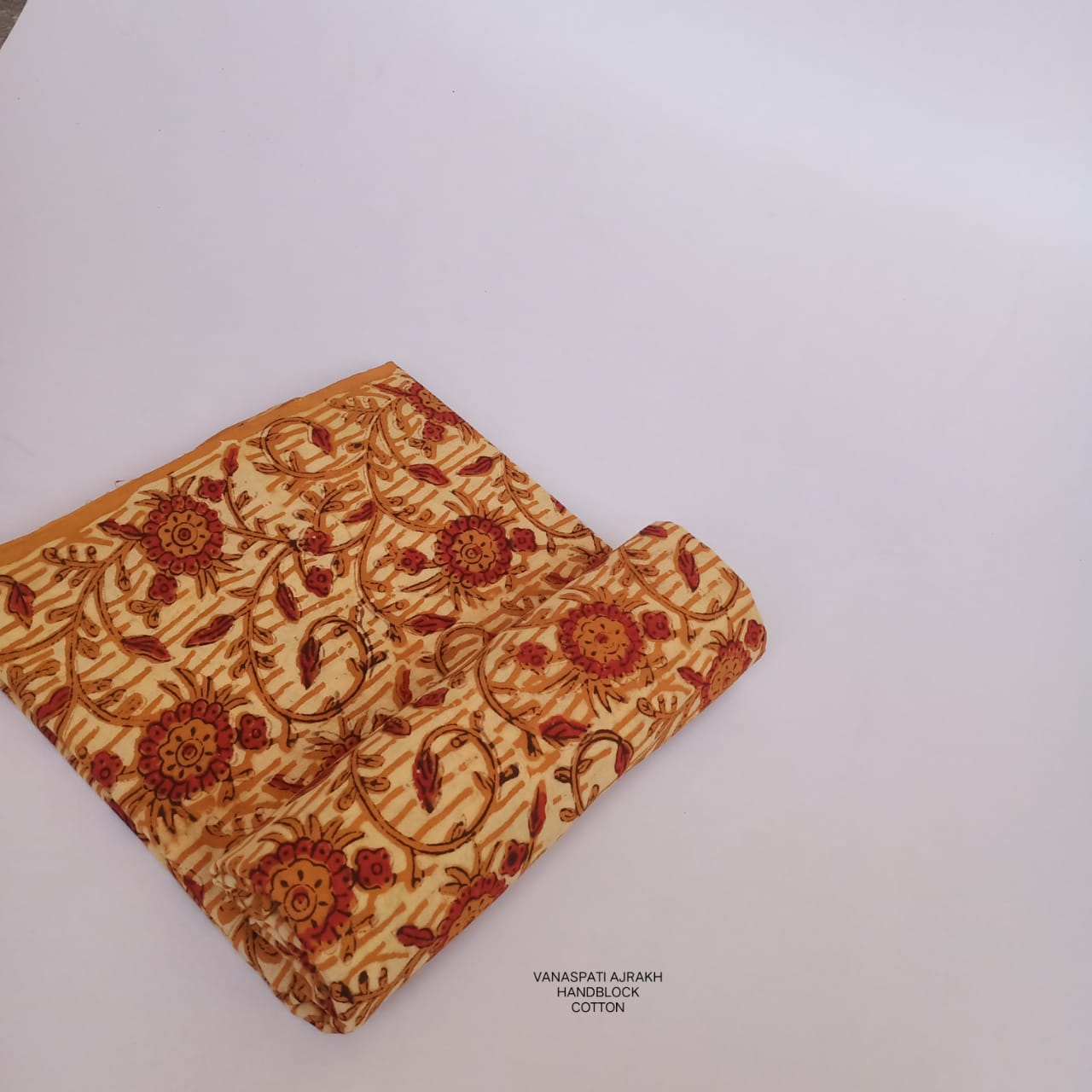 Abstract Vanaspati design on cream Bagru handblock printed pure cotton fabric, artisan-crafted for Fabtexs sustainable wholesale line.