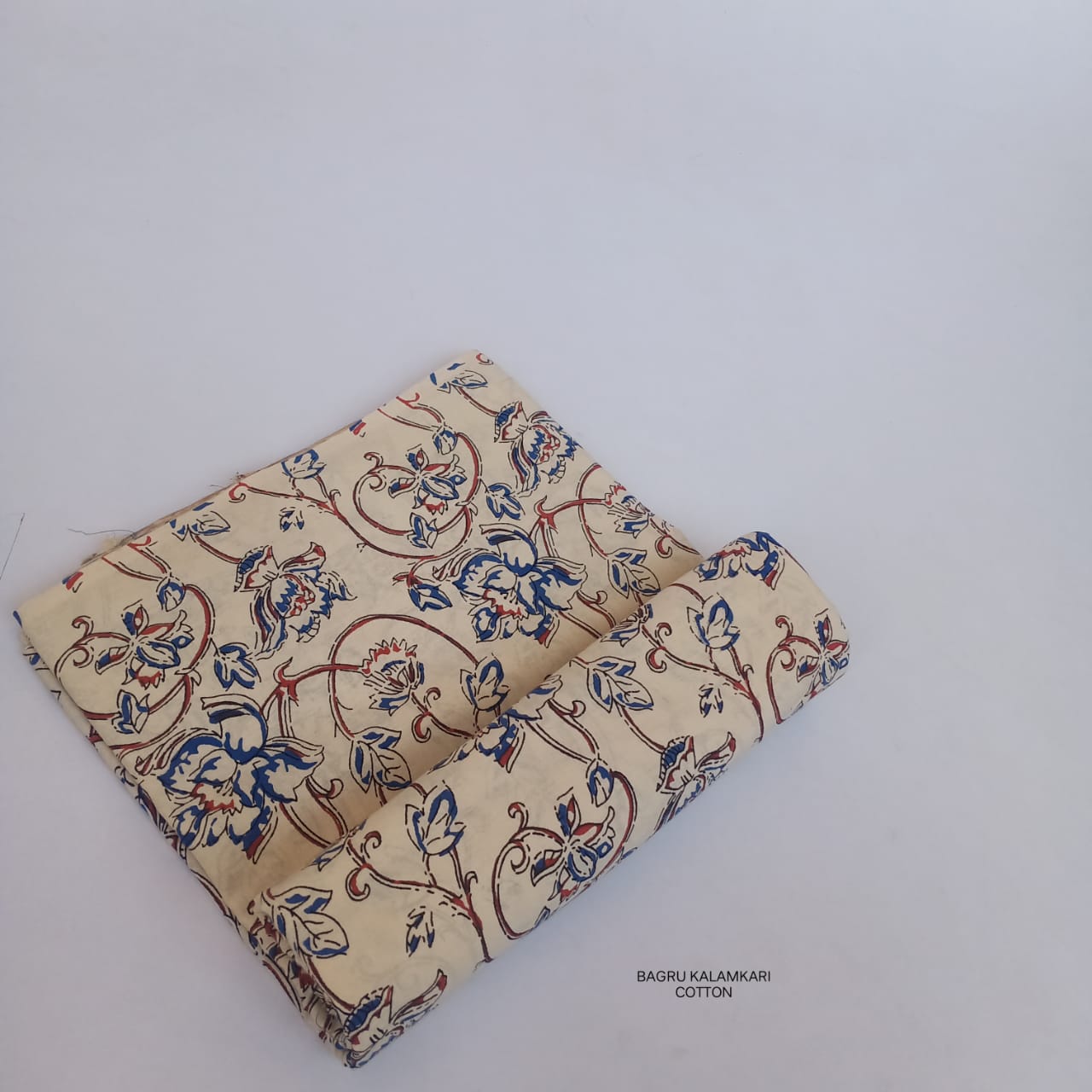 Cream floral jaal Bagru handblock printed pure cotton fabric, handcrafted using wooden blocks and natural colors for Fabtexs.