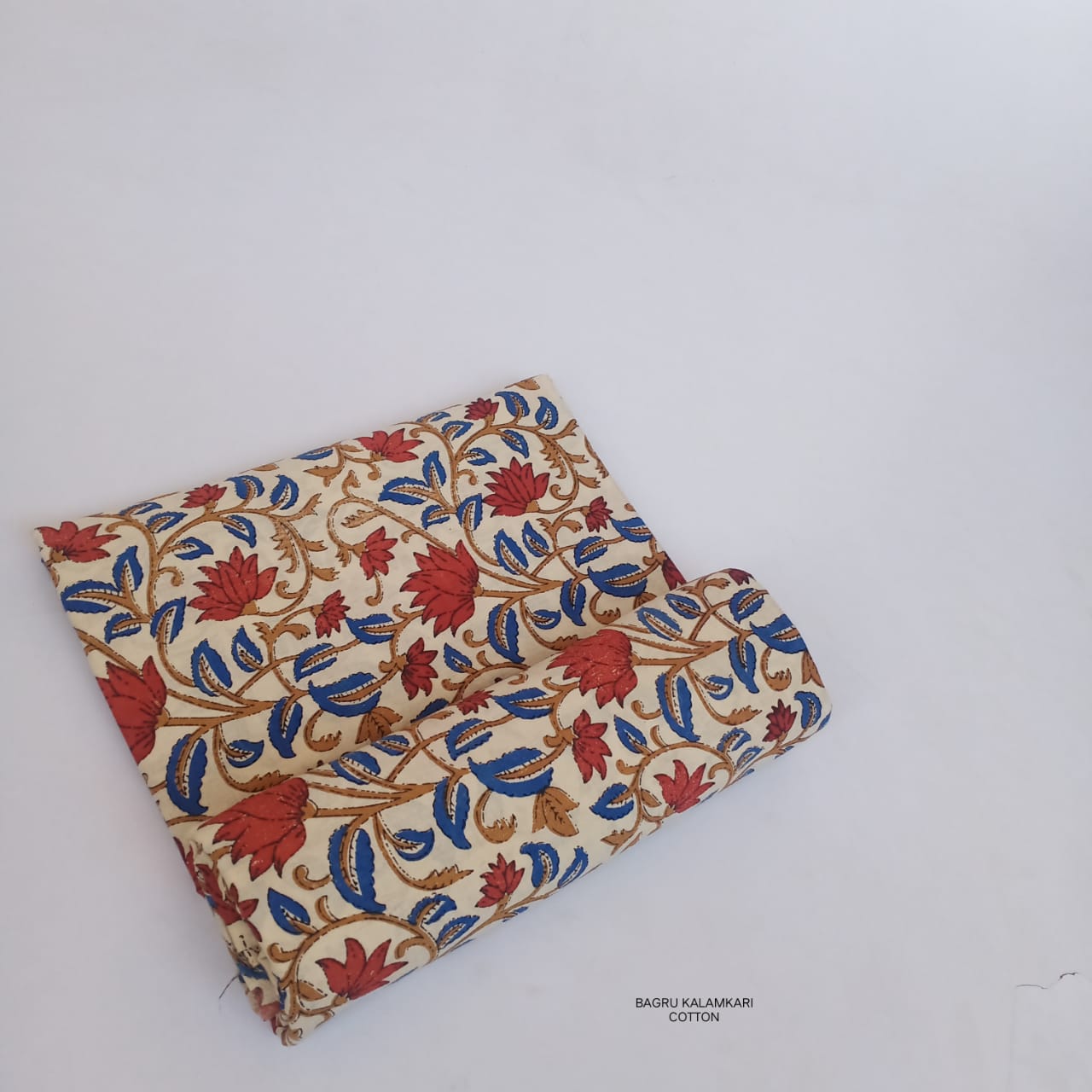 Lotus floral jaal Bagru handblock printed pure cotton fabric, handcrafted by artisans in Rajasthan, available for wholesale at Fabtexs.