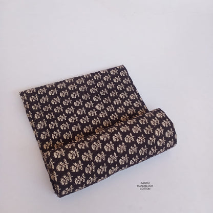 Black Bagru handblock printed pure cotton fabric with small butti design, naturally dyed and slow-made for wholesale textile sourcing.