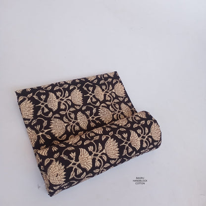 Black floral jaal Bagru handblock printed cotton fabric, artisan-made textile ideal for ethnic and contemporary wholesale buyers.