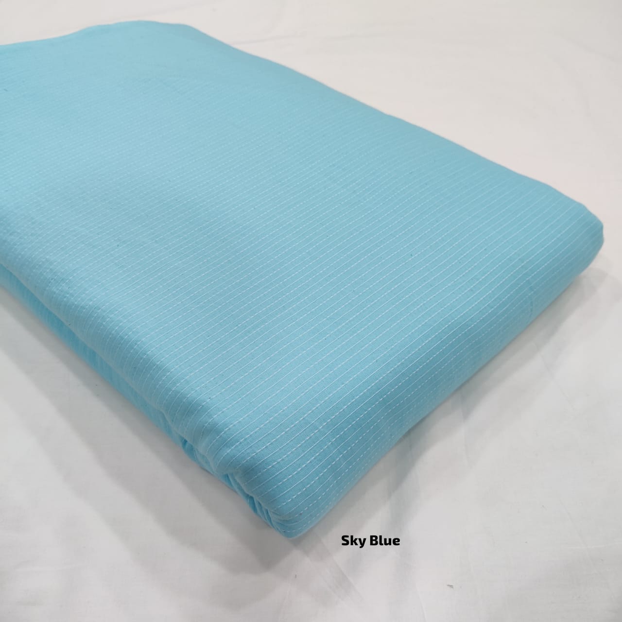 Light blue Kantha cotton fabric with soft stitched pattern, wholesale sourcing from Fabtexs