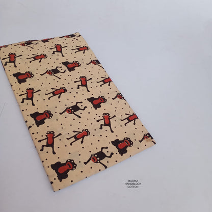 Cream Bagru handblock printed pure cotton fabric with frog motifs, artisan-made using traditional Rajasthan block printing craft.
