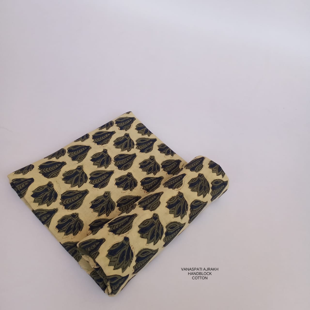 Cream and olive mofti motif Bagru handblock printed pure cotton fabric, handcrafted using Vanaspati dye technique for Fabtexs.