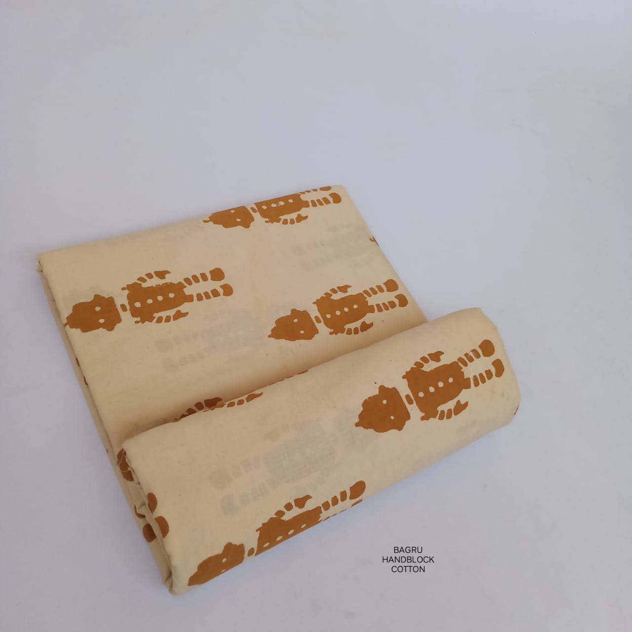 Cream Bagru handblock printed pure cotton fabric featuring quirky robot motifs, artisan printed for creative textile collections.