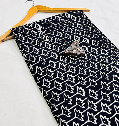 Black star-motif Dabu mud-resist printed pure cotton fabric, sustainable and artisan-crafted for bulk wholesale orders via Fabtex.