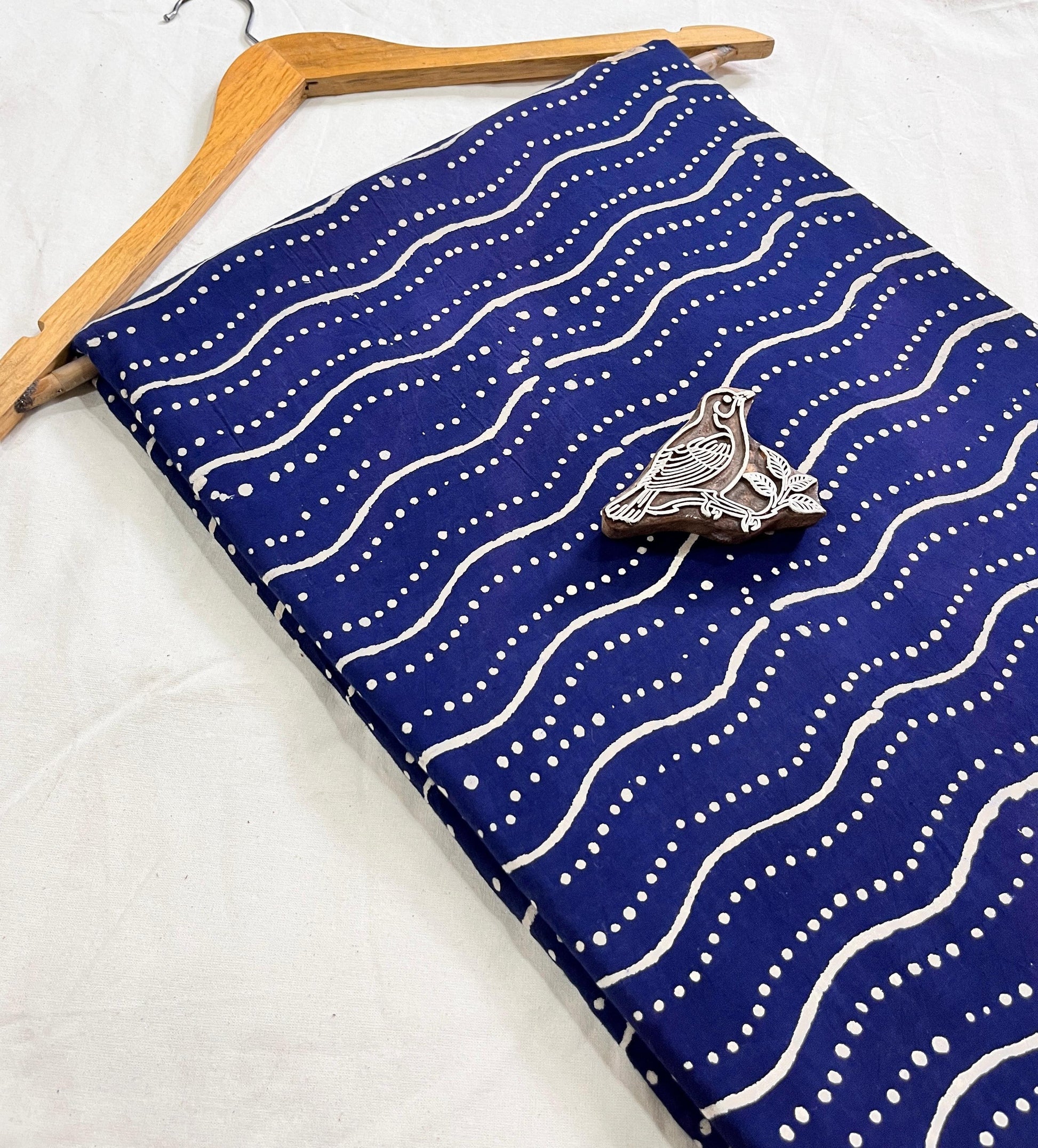 Rich indigo natural-dyed Dabu handblock pure cotton fabric, authentic Rajasthan craft supplied wholesale by Fabtex.