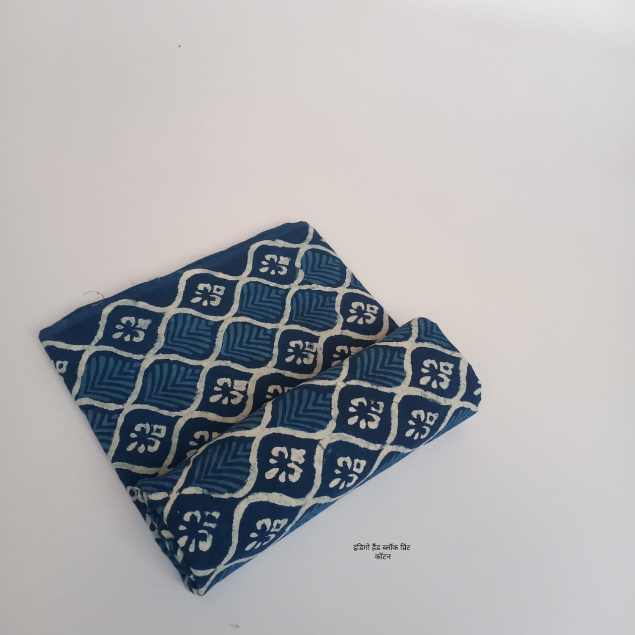 Indigo floral petal dabu handblock cotton fabric, delicate artisan floral design on pure cotton