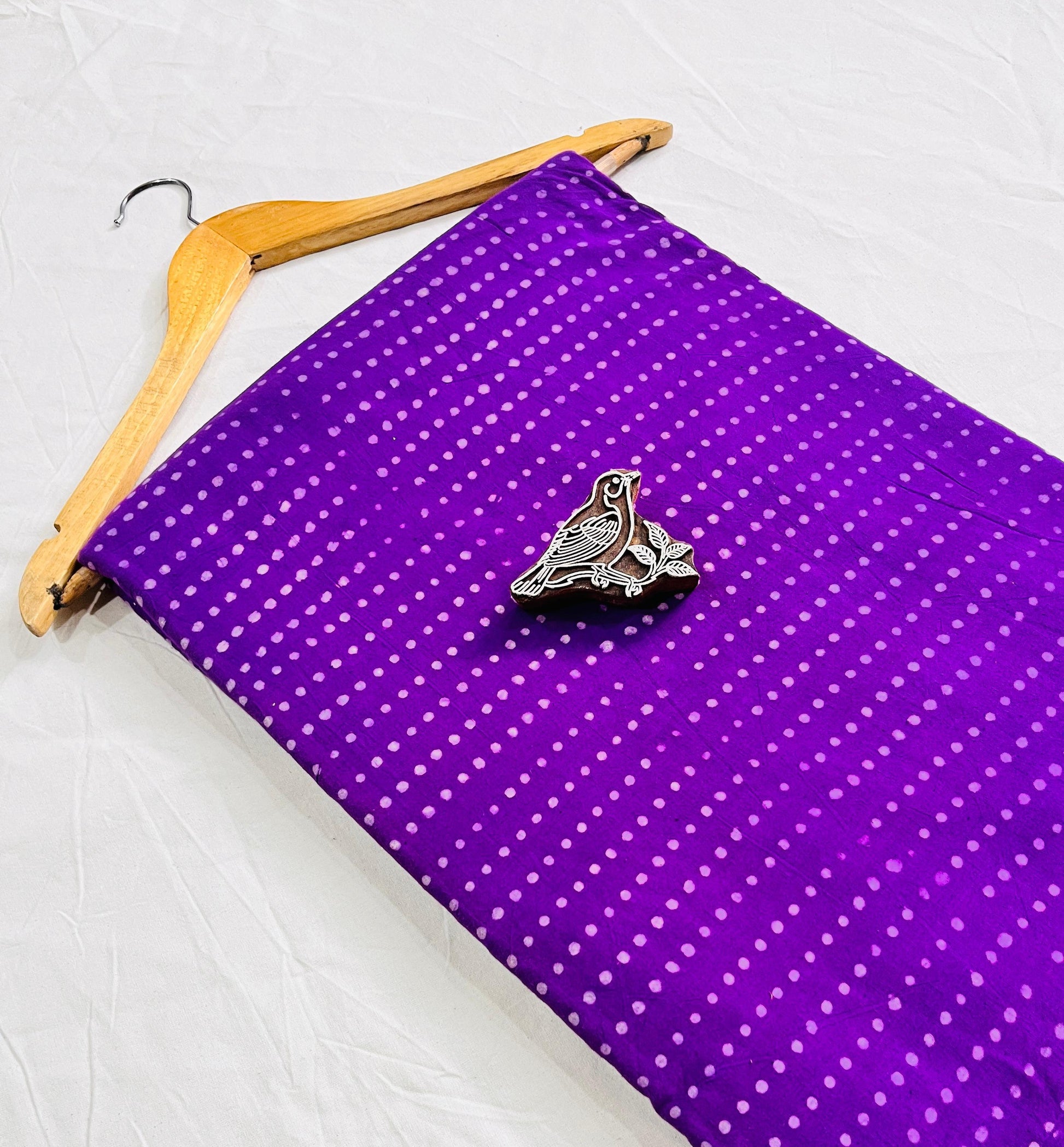 Purple dotted Dabu handblock printed cotton fabric, natural-dyed and ideal for designers seeking wholesale Dabu prints from Fabtex.