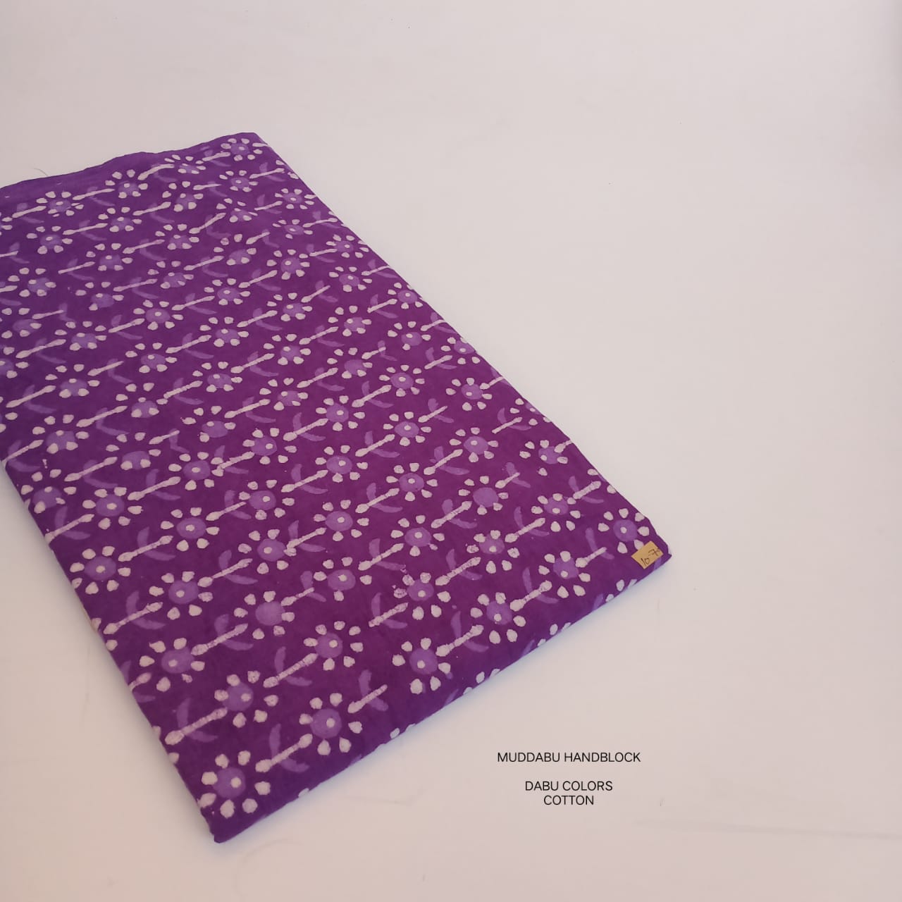 Purple floral butti Dabu handblock printed cotton fabric for wholesale buyers