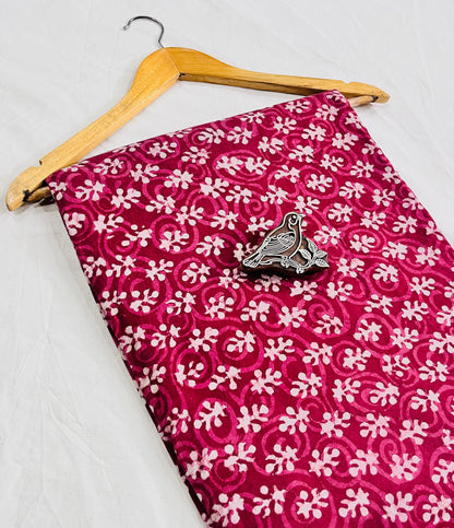 Pink floral Dabu handblock cotton fabric, crafted using mud-resist printing for boutique-grade wholesale supply by Fabtex.